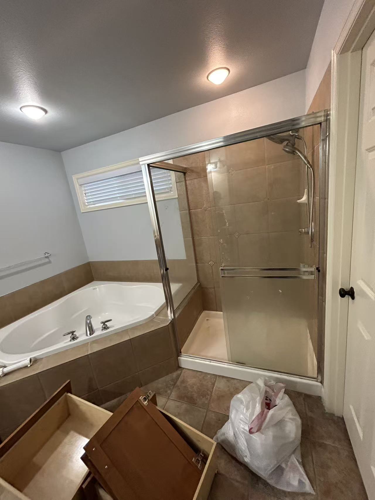 Bothell master bath stage 1 — original bathtub before renovation