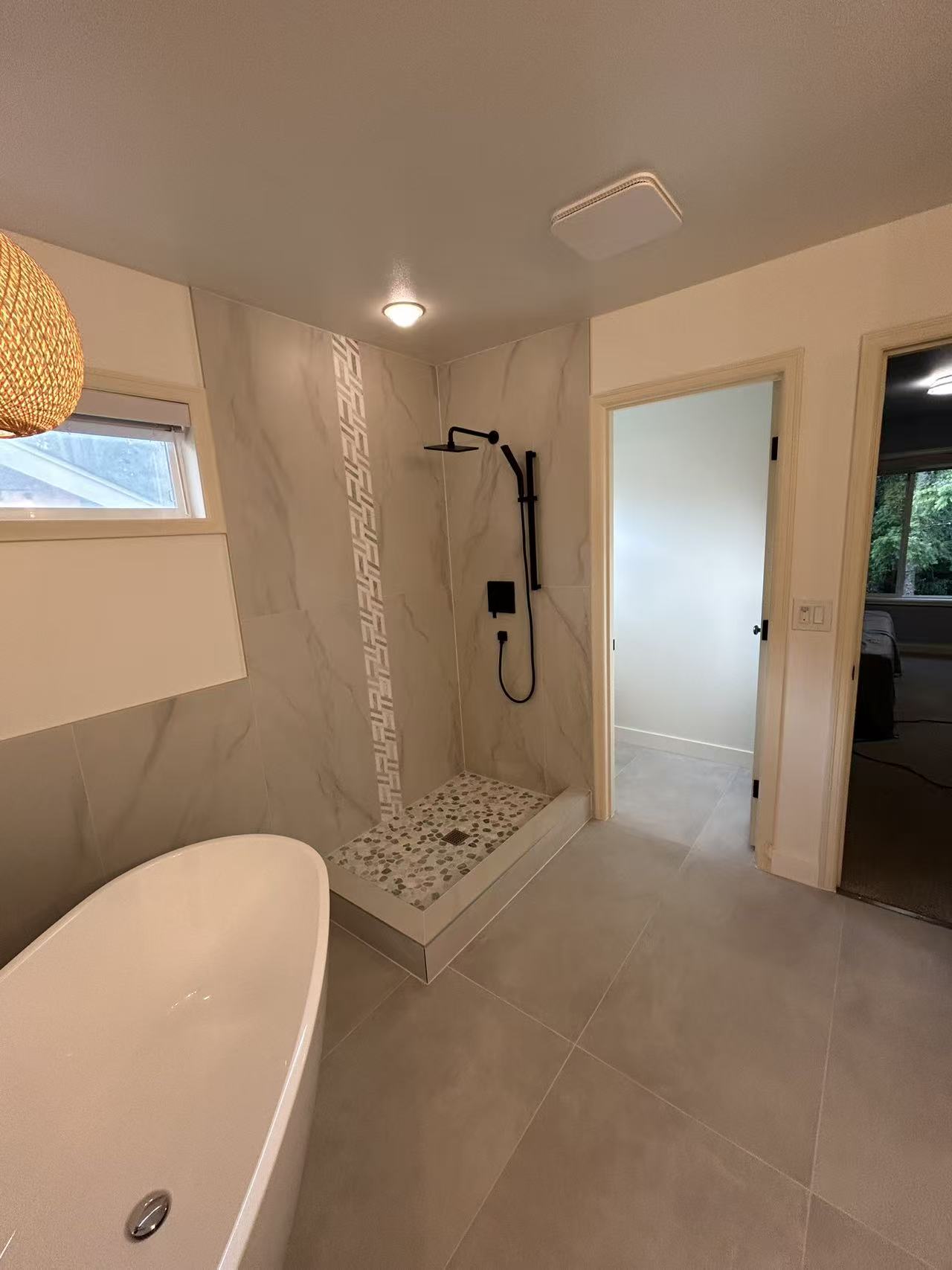 Bothell master bath stage 8 — walk-in pebble-floor shower