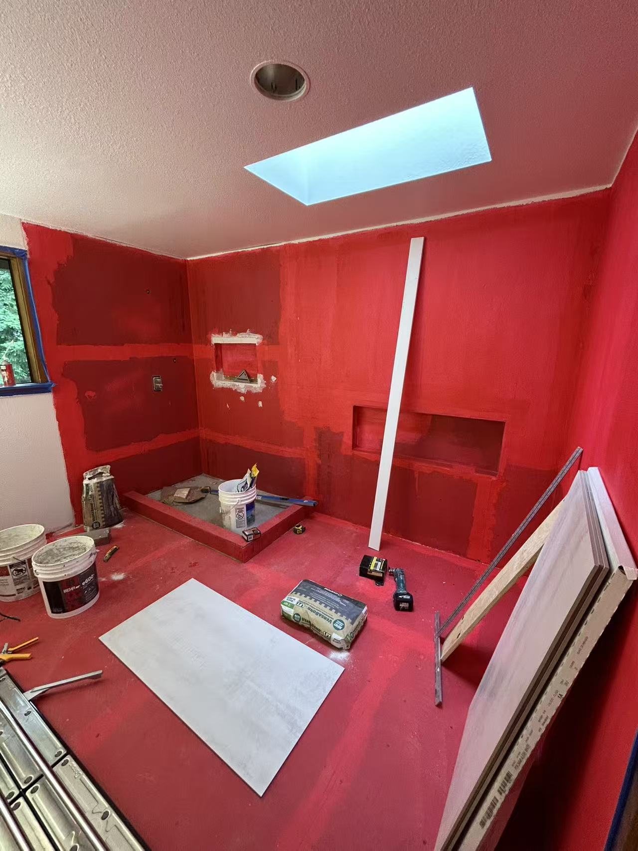 Bellevue spa bath stage 3 — red waterproofing membrane in wet zone